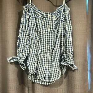 White and navy checkered cold shoulder top. Size L